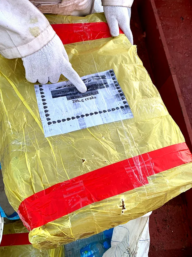 Sealed and labelled package of frozen seafood