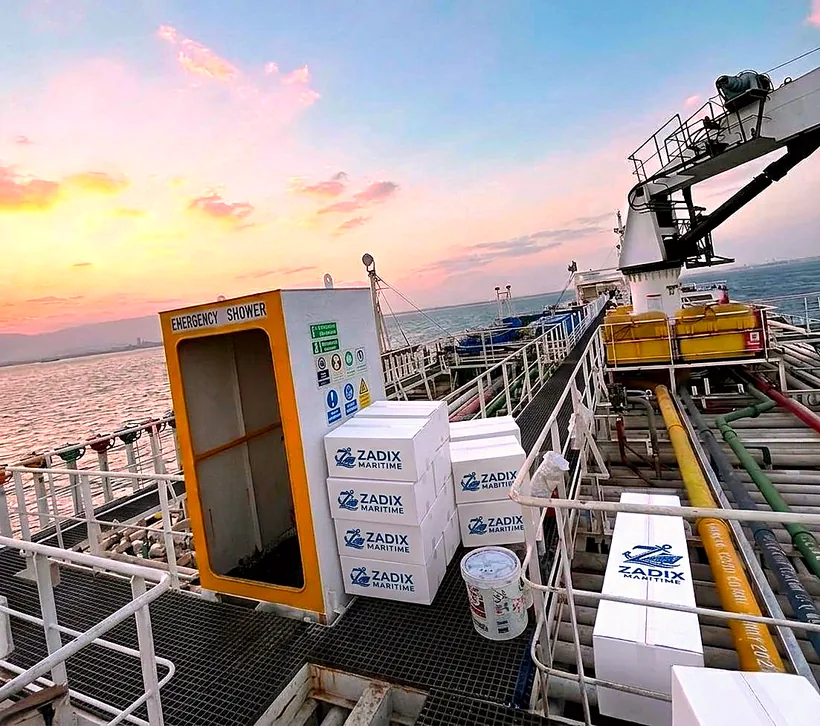 Zadix branded boxes on a tanker deck at sunset