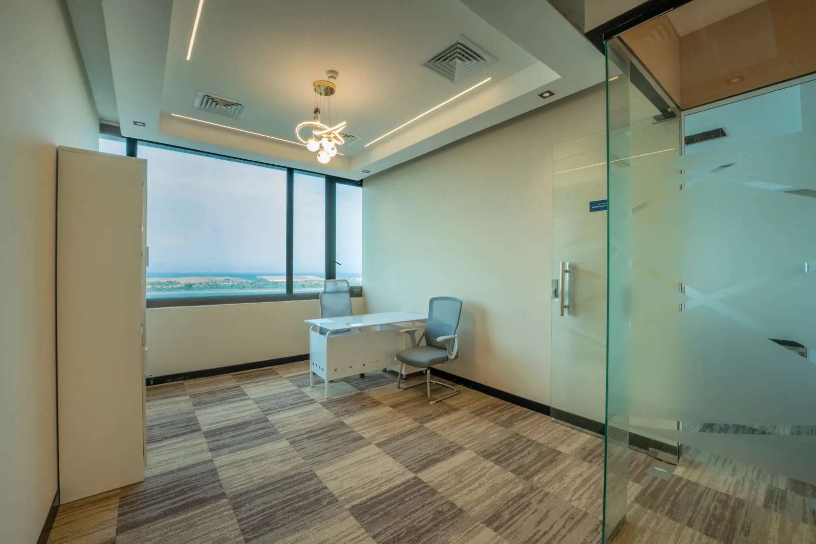 Private office at the Zadix Abu Dhabi branch, with a view over the water