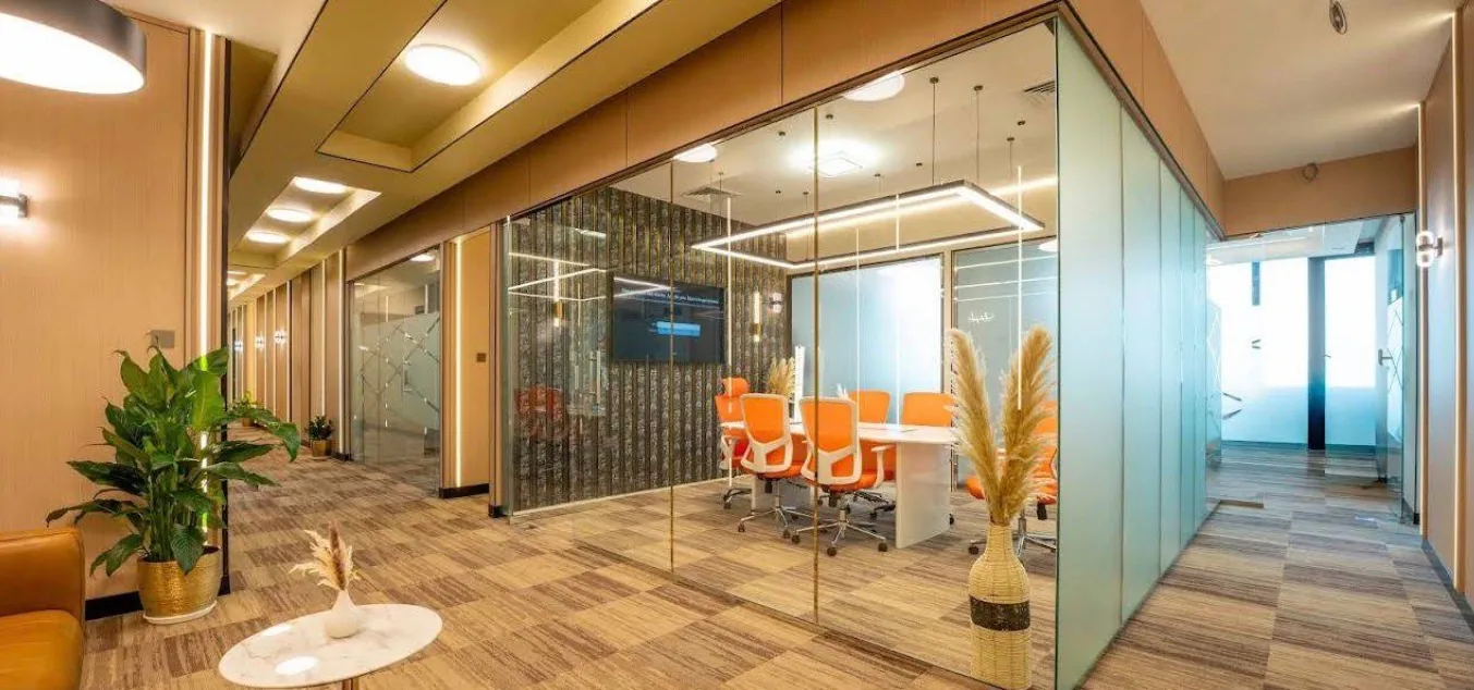 Glass-walled meeting suite at the Zadix Abu Dhabi office